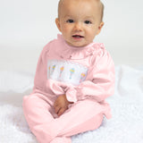 Baby Rattle Smocked Knit Onesie In Pink